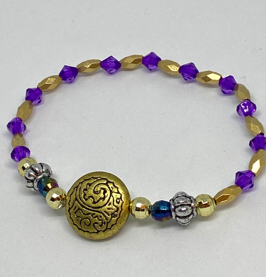 7.5" beaded flexible bracelet gold. Silver, purple