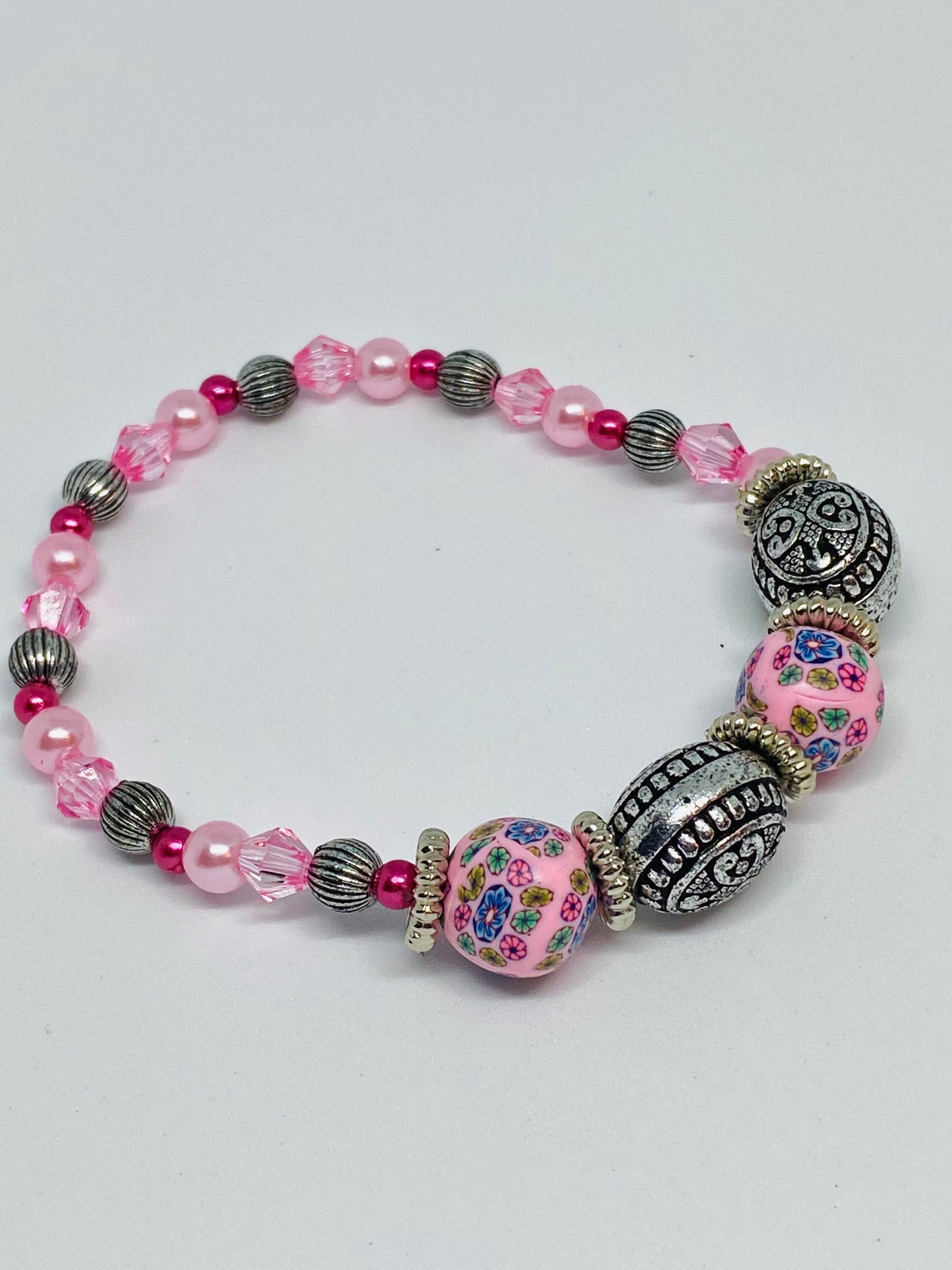 7” beaded flexible bracelet silver and 2 pink shades